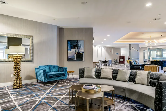 Elegant and contemporary lounge area featuring plush seating, stylish decor, and a modern ambiance perfect for relaxed gatherings.
