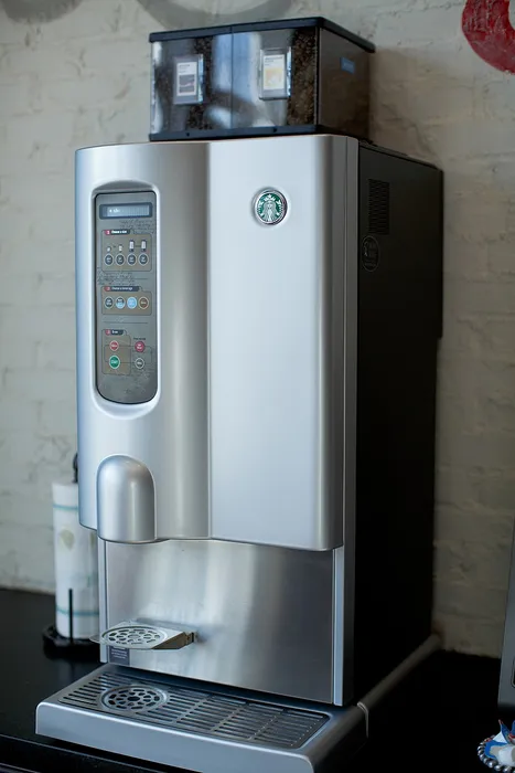 Sleek coffee machine with intuitive controls, perfect for brewing premium beverages. Modern design complements any space.