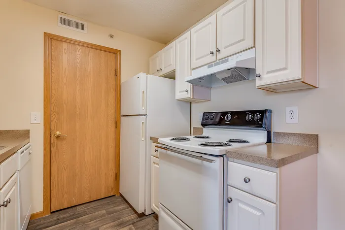 Charming kitchen with modern appliances and sleek cabinetry, perfect for culinary enthusiasts.