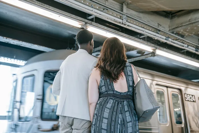 a-couple-standing-on-the-train-station-8555077
