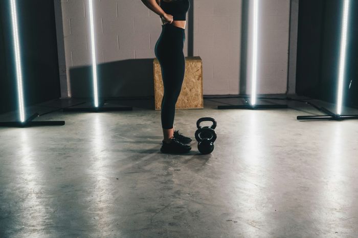 Modern fitness space with kettlebell and sleek LED lighting, perfect for dynamic workouts.