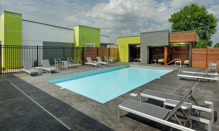 Pool With Loungers and Cabanas at The Edge Luxury Apartments