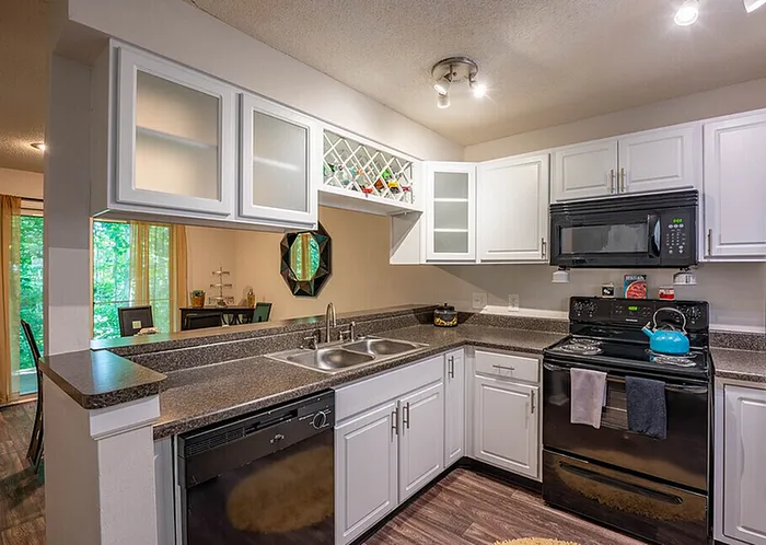 Kitchen with stainless steel appliances at Scandia Apartments