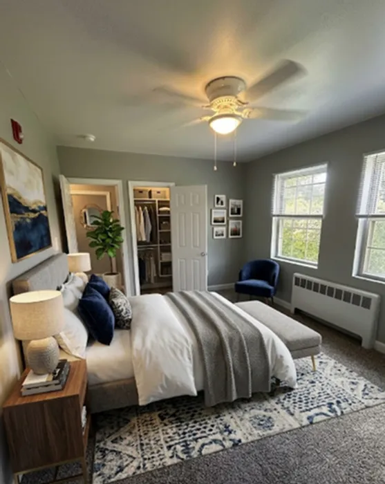 Inviting bedroom featuring soft natural light, elegant decor, and a cozy bed with stylish linens.
