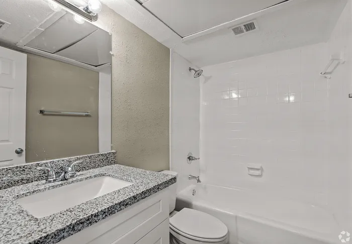 Upgraded bathroom with tub and shower at Fox Trail Apartments