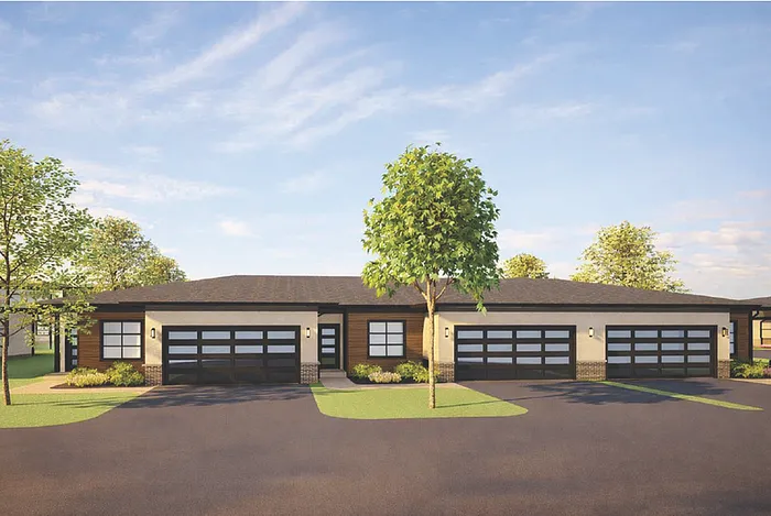 Modern single-story duplex with sleek architecture, large glass garage doors, and vibrant landscaping under a clear blue sky.
