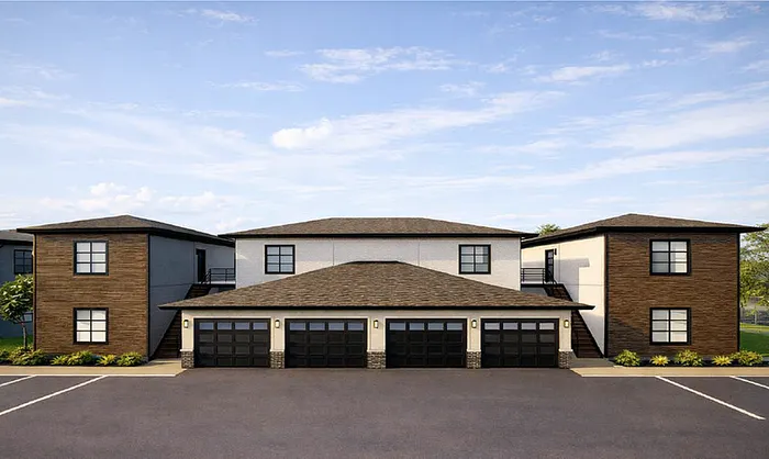Modern duplex apartment complex featuring sleek architectural design, spacious parking, and contemporary finishes.