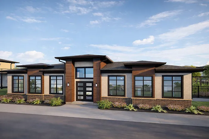 Modern single-story apartment exterior with sleek design, large windows, and stylish landscaping against a blue sky backdrop.