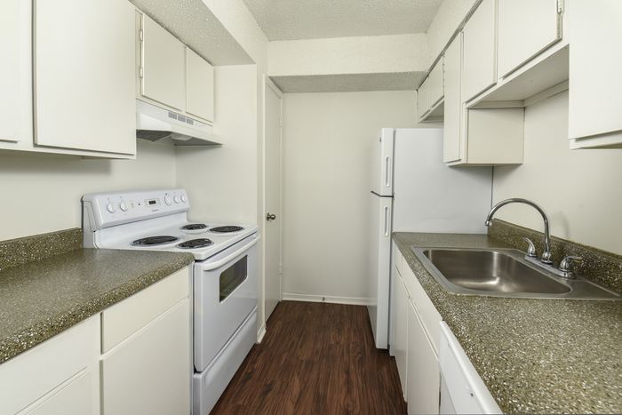 Galley Kitchen | White Cabinets | White appliances