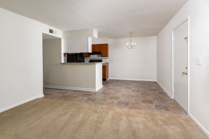 Carpeted Living Area | Vinyl Dining Area | Branchwood Apartments