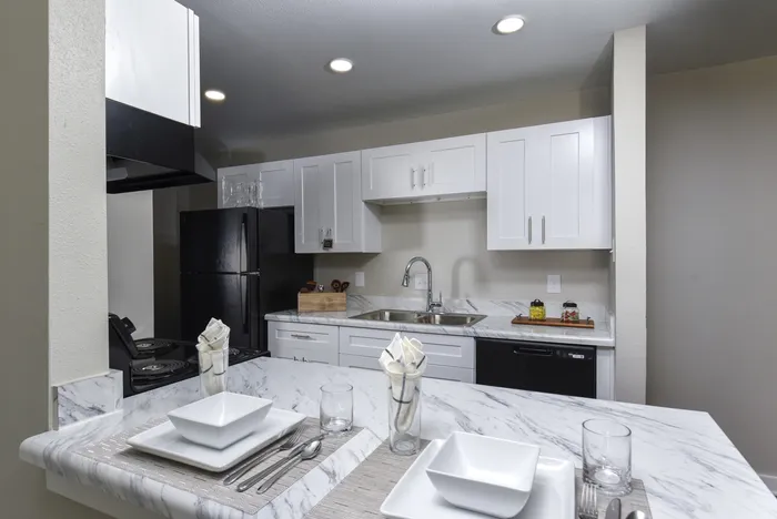 Kitchen | White Cabinets | Black Appliances | Goose Neck Faucet