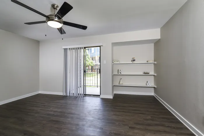Living Area | Built In Shelves | Sliding Glass Door