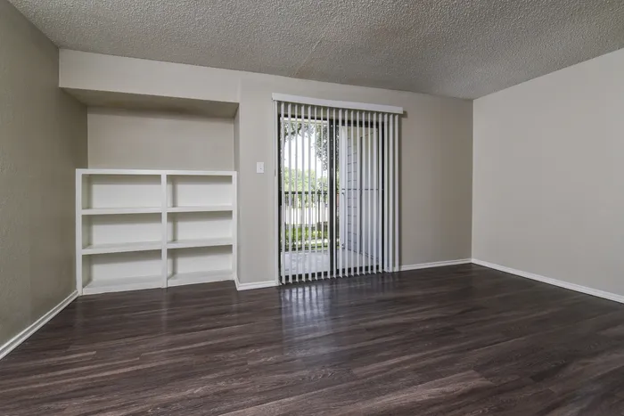 Living Area | Built in Shelves | Sliding Glass Doors