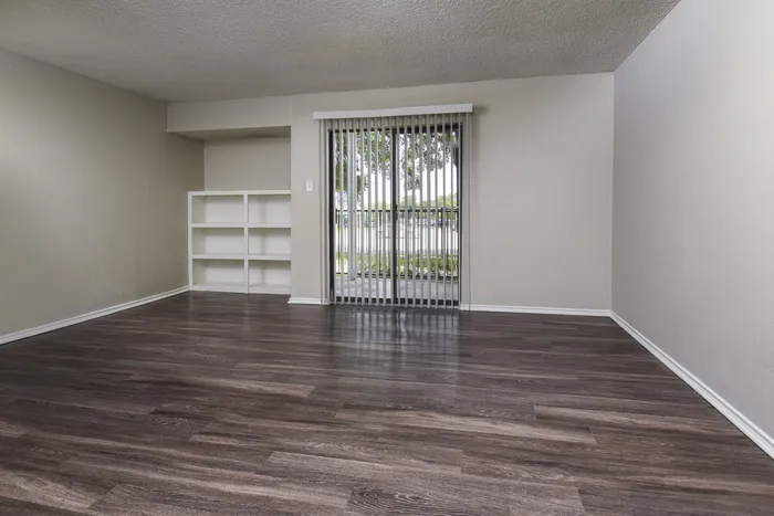 Living Area | Plank flooring | Built in Shelving | Sliding Glass Doors