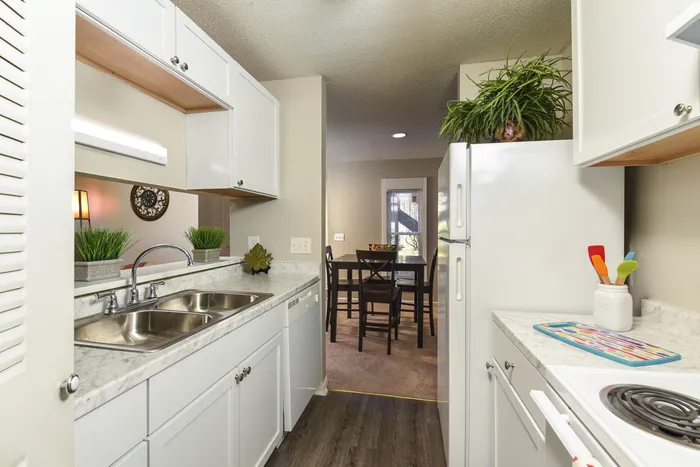 Two Bedroom Kitchen | White Cabinets | Plank Flooring