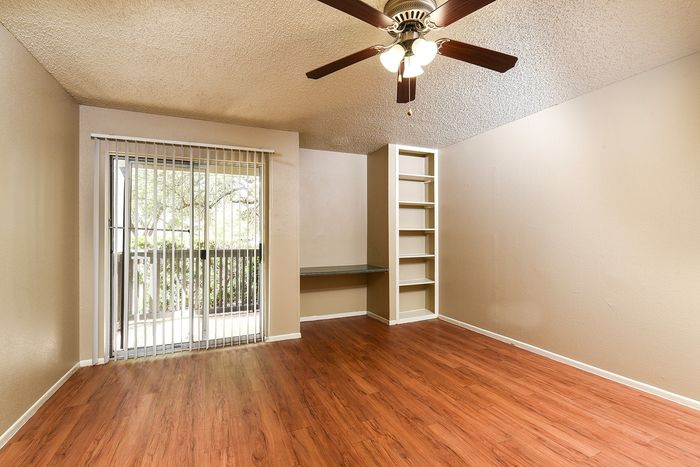 A1 Livining Area | Sliding Door | Built-in Entertainment area and book shelves | wood plank flooring