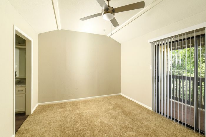 2/2 Primary Bedroom | Sliding glass doors to deck