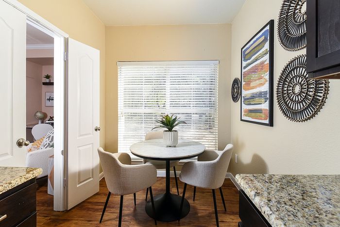 Dining area off kitchen | Large window | table with 3 chairs