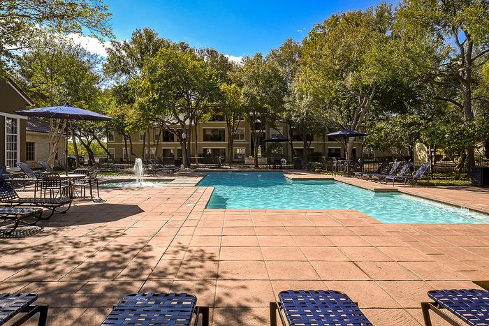 Pool area | fountain | table and chairs lounge chairs