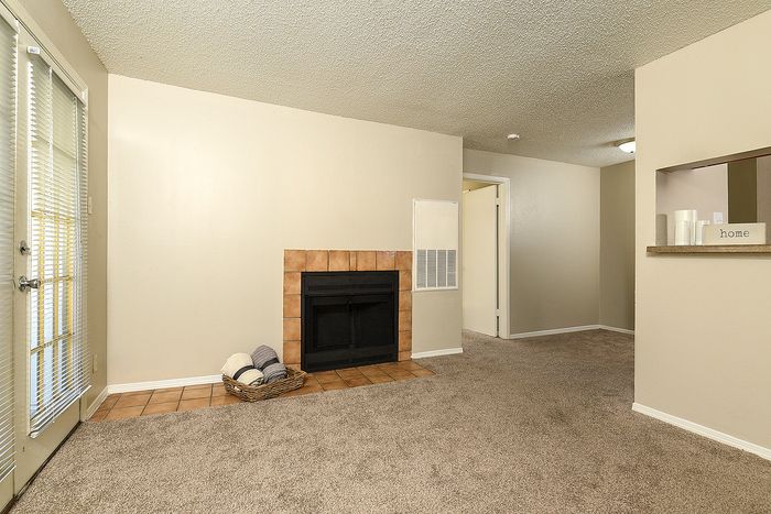 Classic One Bedroom | Living Area | Fireplace | French Doors