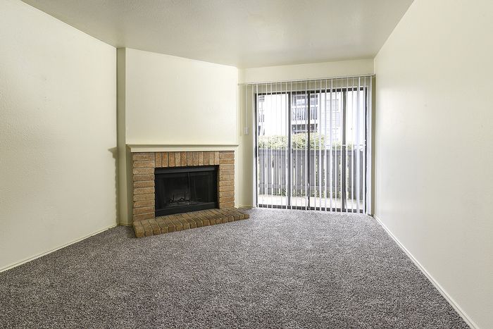 Brick wood burning fireplace | Sliding glass doors