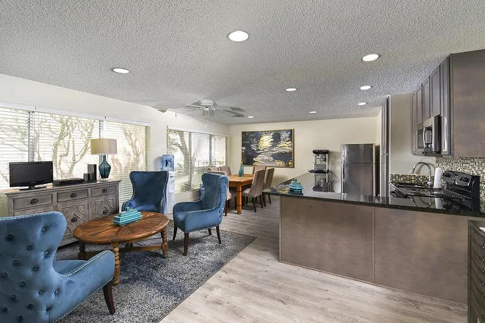 Riverstone office with 2 seating areas and an open kitchen