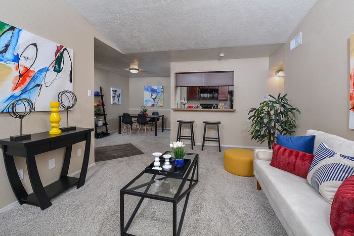 B floor plan | Living room | Dining Area | Kitchen with black appliances