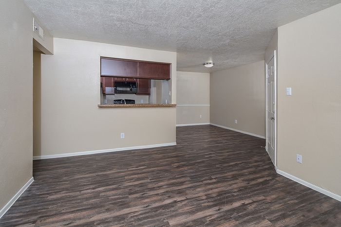 C floorplan | Living area | Open Kitchen with black appliances | Plank Flooring