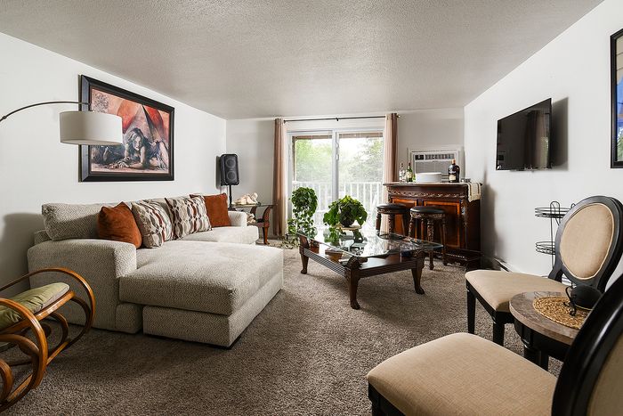 Inviting living room with plush sectional sofa, perfect for relaxation and entertainment.