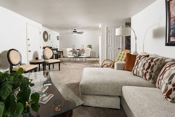 Inviting living and dining space with plush seating, and a cozy atmosphere, ideal for relaxation and entertaining.