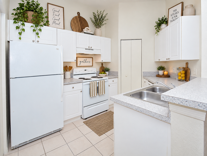 Bright, inviting kitchen with sleek white cabinetry, modern appliances, and stylish decor accents.