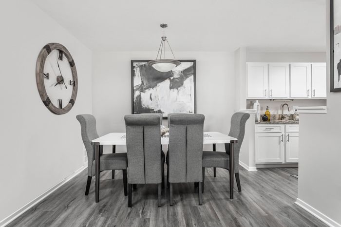 Charming dining area with view of newly renovated kitchen at Pointe at Canyon Ridge apartments for rent