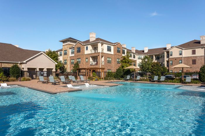 Refreshing salt water swimming pool with sundeck at Avenues at Craig Ranch apartments for rent in Dallas