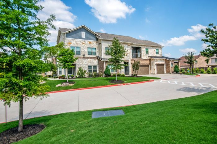 Exterior view of residential buildings at The Adley Craig Ranch apartments for rent in McKinney, TX