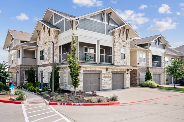 Attached garages with direct entry available for residents at The Adley Craig Ranch apartments for rent in McKinney, TX