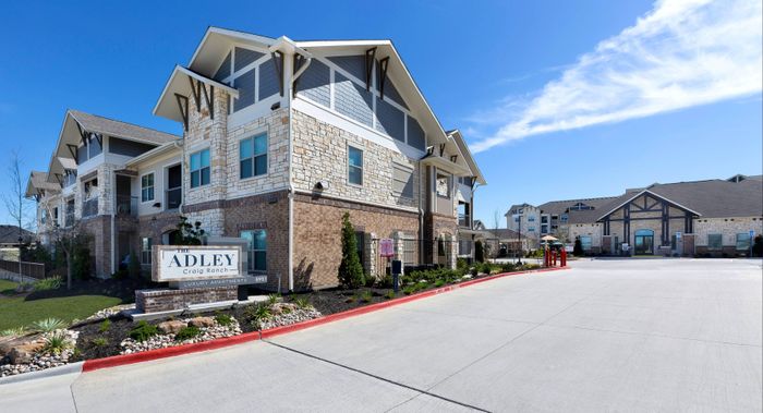 Entrance sign to The Adley Craig Ranch apartments for rent in McKinney, TX