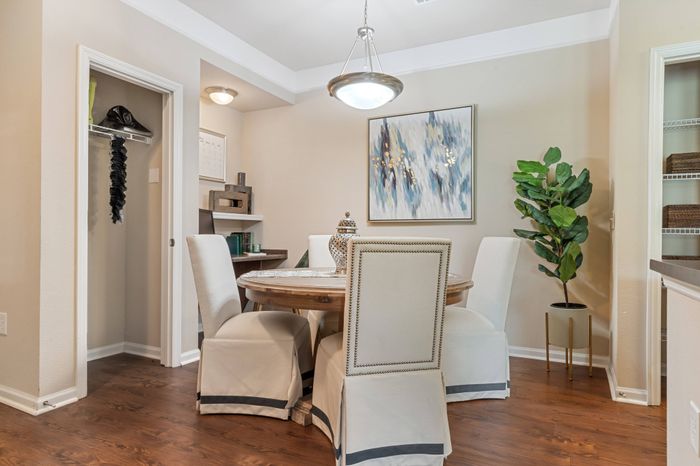 Elegant dining area with table and chairs at St. James at Goose Creek apartments for rent