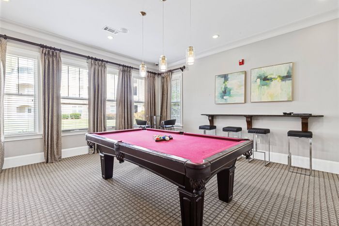 Game room with pool table at St. James at Goose Creek apartments for rent in Charleston, SC