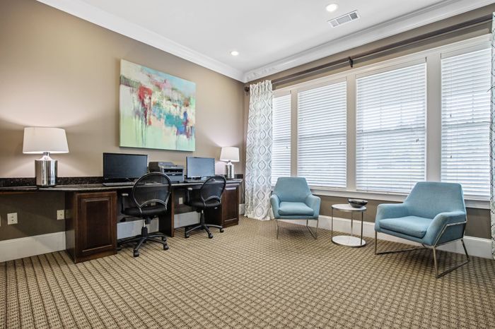 Business center with lounge seating and free WiFi at St. James at Goose Creek apartments for rent