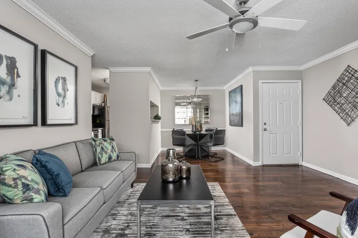Open living room and dining room with hardwood flooring