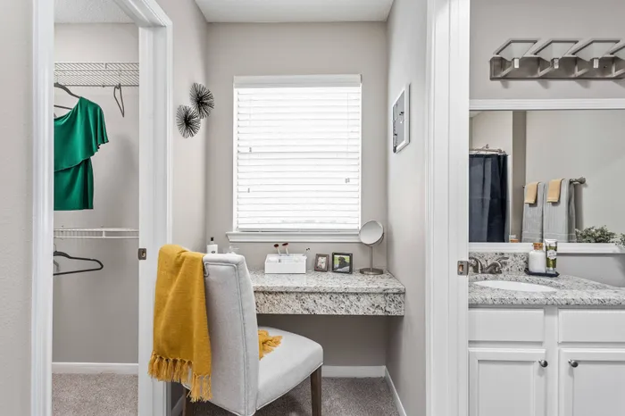 Master bedroom in Memphis apartment for rent with makeup vanity area connected to walk-in closet