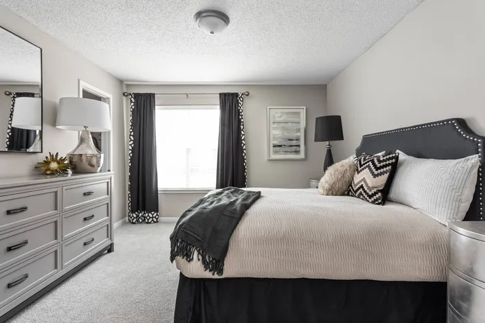 Spacious bedroom with plush carpeting at Arbors River Oaks Apartment Homes