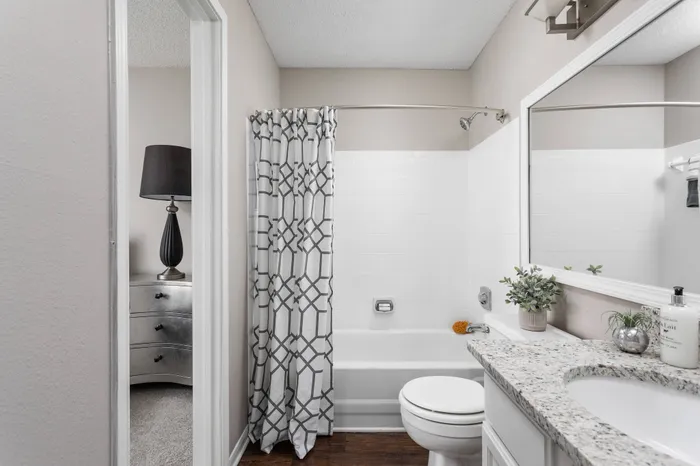 Spacious full bathroom connected to bedroom in Memphis apartment for rent