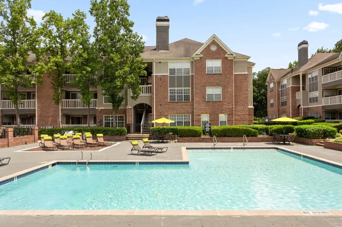 Sparkling outdoor salt water swimming pool at Arbors River Oaks Apartment Homes
