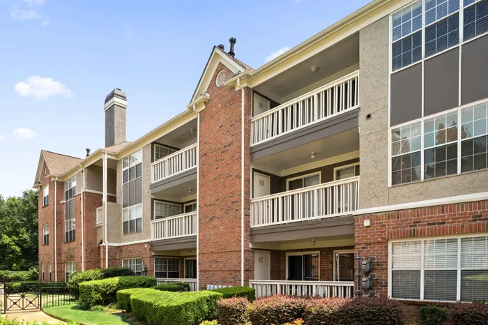 Exterior of brick apartment building with private and spacious patios and balconies in Memphis