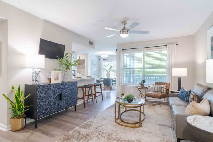 Newly Renovated Living Room With Hardwood Style Flooring And Breakfast Bar