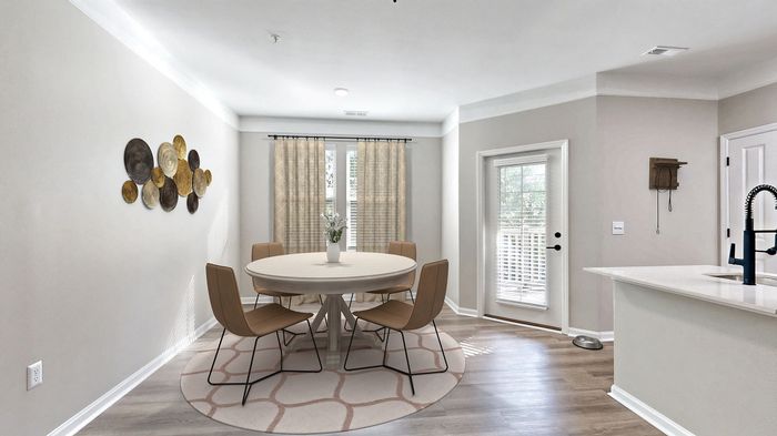 Elegant dining area with table and chairs at St. James at Goose Creek apartments for rent