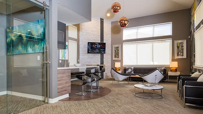 Elegant modern living room with stylish furnishings, large windows, and vibrant artwork, perfect for comfortable living.