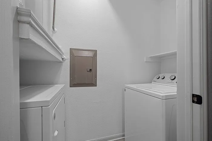 Utility room with full size washer and dryer