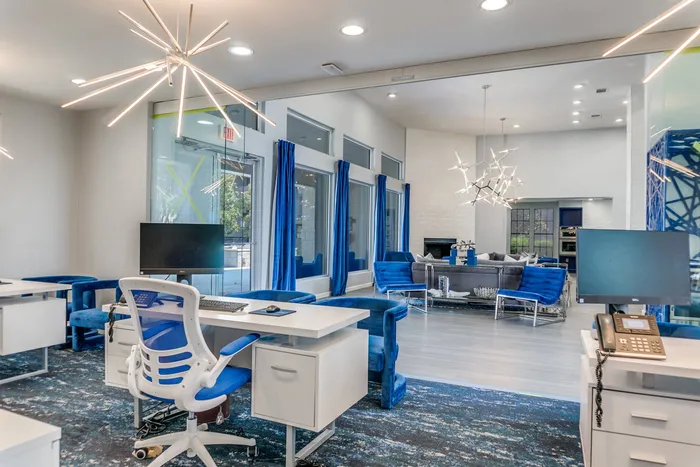 Leasing office with desk and blue chairs